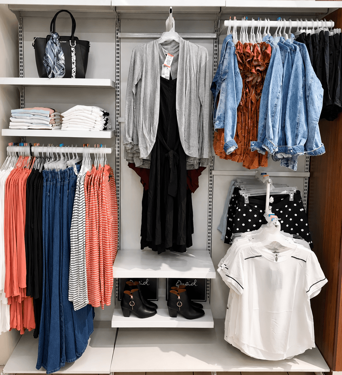 Women's boutique wall — curated hanging display with accessories