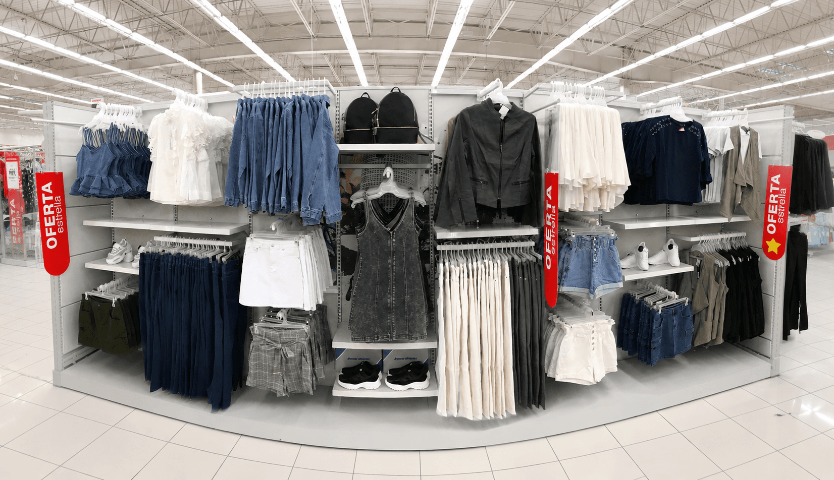 Women's department gondola — denim and tops with Oferta promotional flags